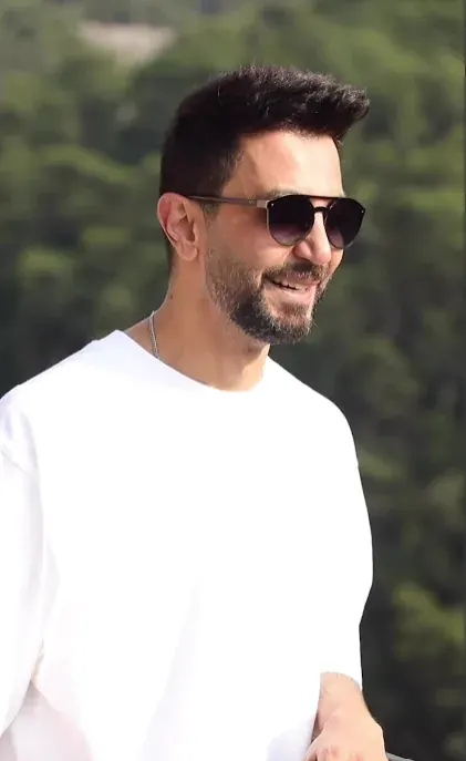 Artist interview frame, smiling DJ in sunglasses